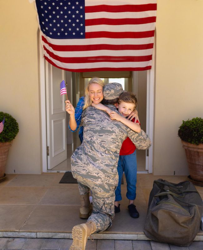 military family with US flag over door - welcome home - magnific